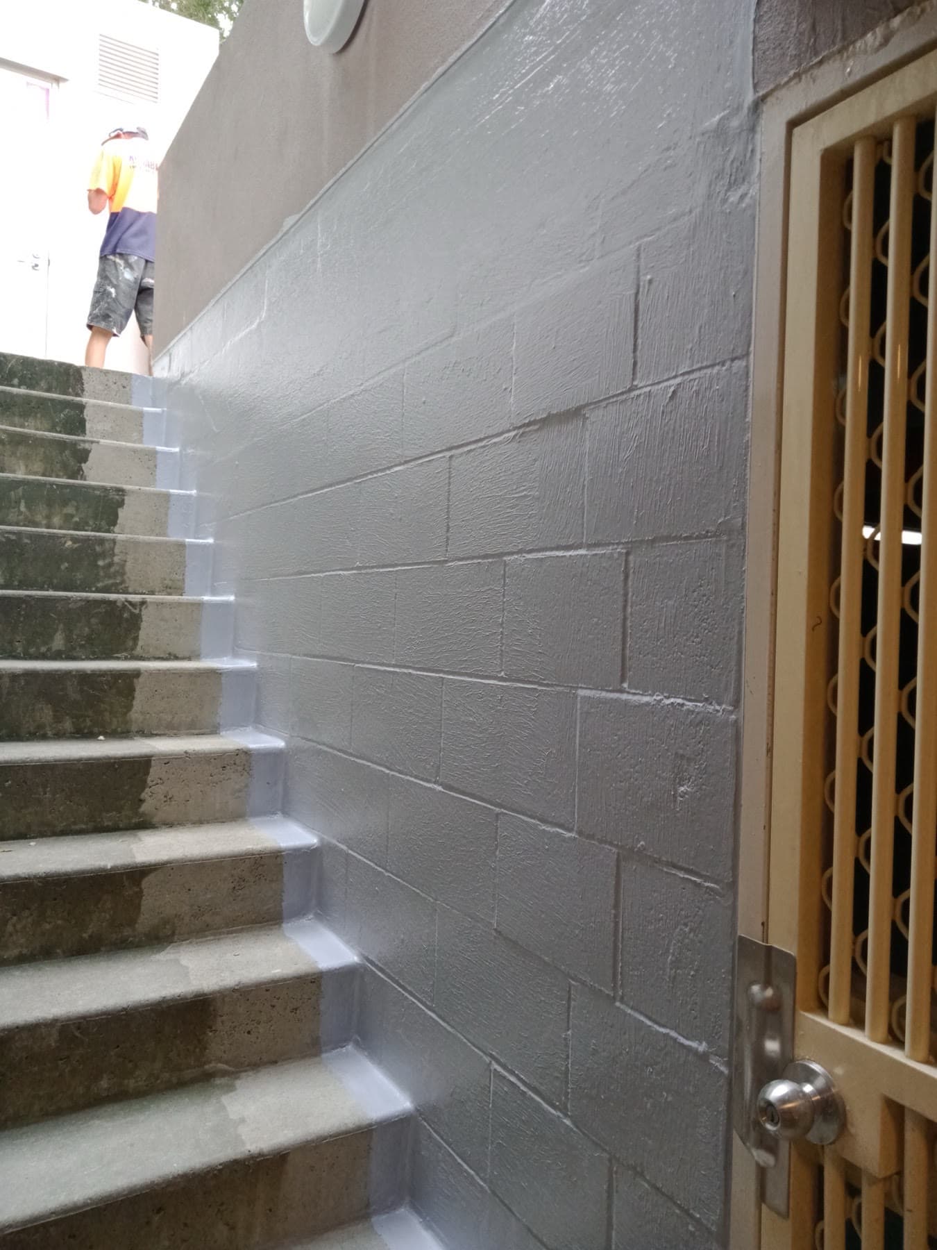 External wall waterproofing beside residential concrete stairs