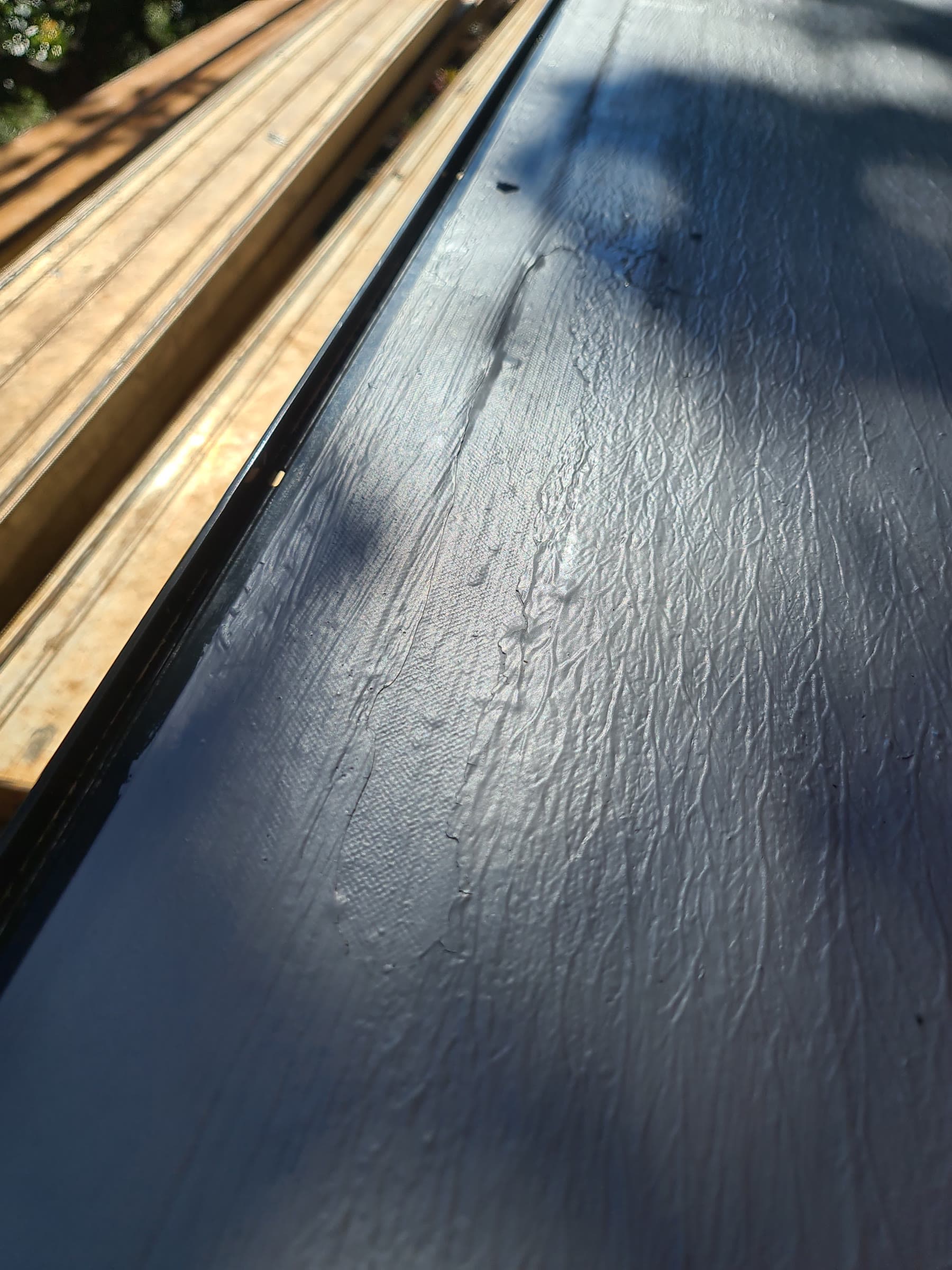 Close-up of liquid waterproofing membrane with reinforcing detail
